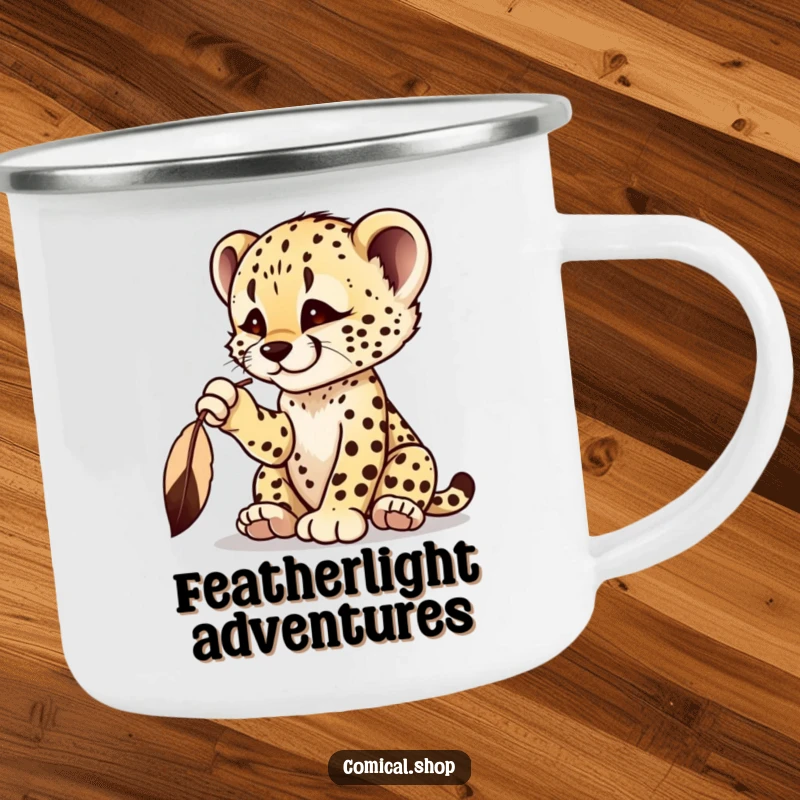 Funny cheetah cub camping mug featuring a playful cub batting at a dangling feather, ready for the outdoors.