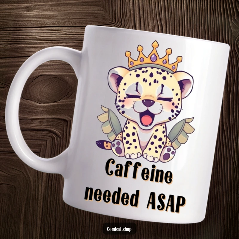 Funny sleepy cheetah cub wearing a feathered crown, yawning adorably on this cozy mug, a perfect gift.