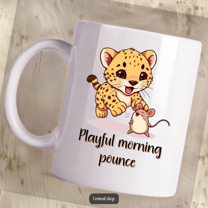 Funny cheetah cub excitedly pouncing on a bouncing toy mouse on a mug, perfect for playful people.