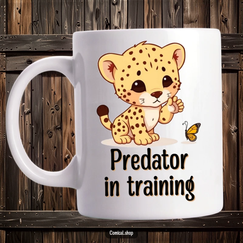 Funny mug featuring a determined cheetah cub with one paw raised, ready to pounce on a tiny butterfly, showcasing playful hunting instincts.