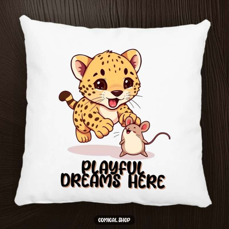 Funny cheetah cub excitedly pouncing on a bouncing toy mouse on a pillow, perfect for cozy comfort.
