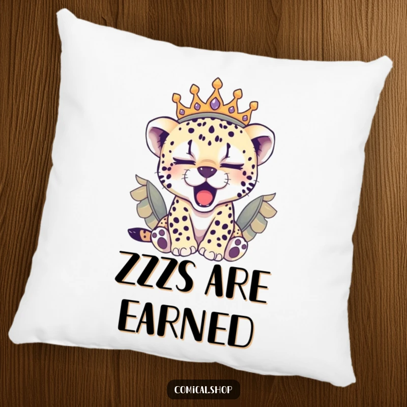 Funny sleepy cheetah cub in a feathered crown yawning, this soft pillow is a cozy and funny gift.