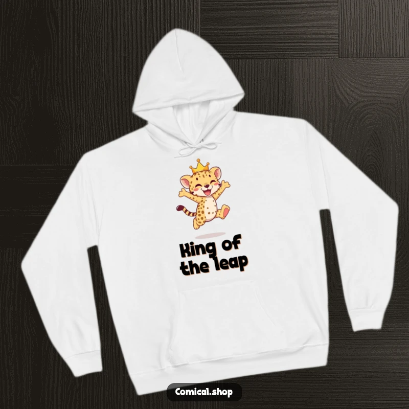 Funny cheetah cub hoodie featuring a crowned cub doing a joyful leap, radiating pure delight.