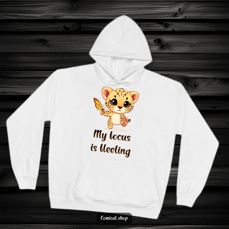 Funny cheetah cub playfully chasing a butterfly with wide eyes, a cozy and humorous design on a warm hoodie for comfort.