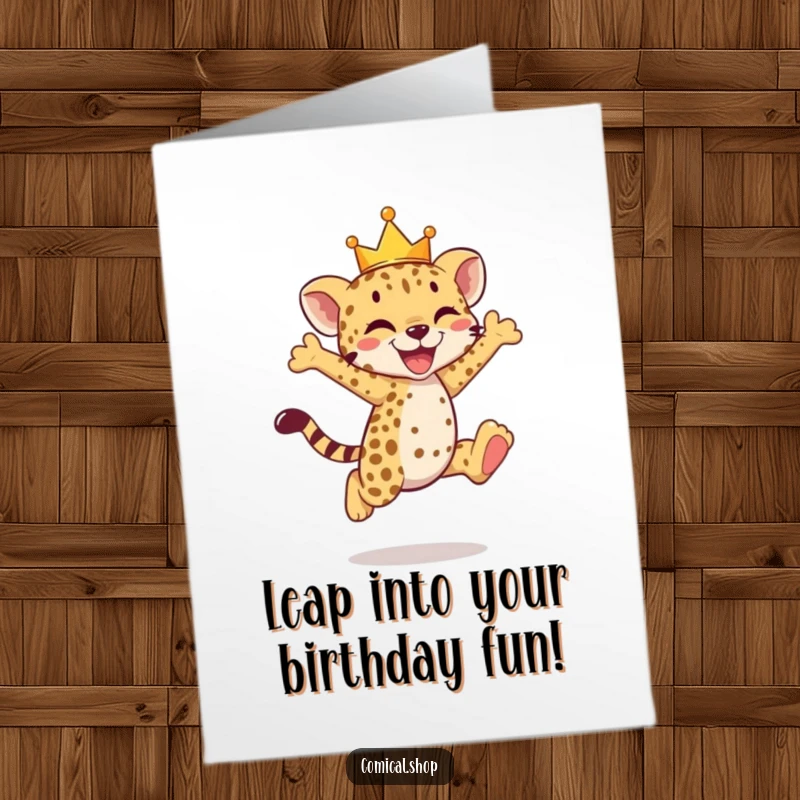 Funny Free Printable Birthday Card: A cheetah cub with a tiny crown joyfully leaps mid-air.