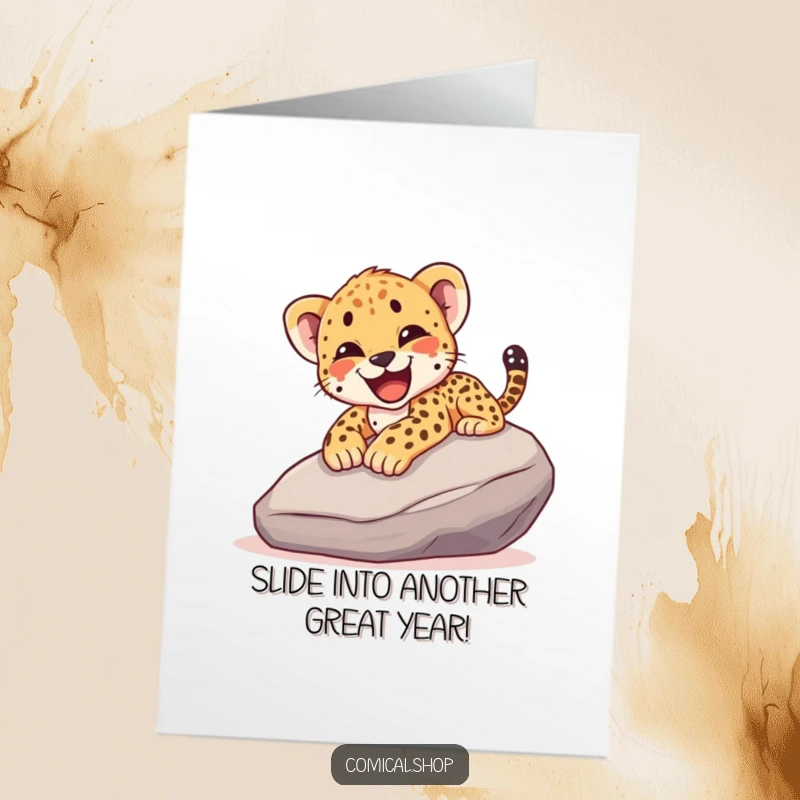 Funny Free Printable Birthday Card: Cheetah cub joyfully sliding down a rock, a wild celebration of another year.