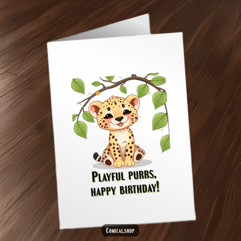 Funny Free Printable Birthday Card: A cheetah cub gleefully batting at a dangling jungle vine, celebrating a birthday.