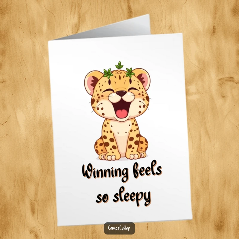 Funny Free Printable Congratulations Card: A laurel-crowned cheetah cub yawns broadly, celebrating victory with sleepy contentment.