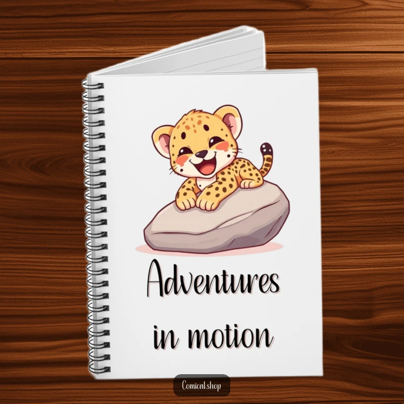 Funny notebook featuring a cheetah cub joyfully sliding down a rock with a happy yelp, perfect for jotting down notes.