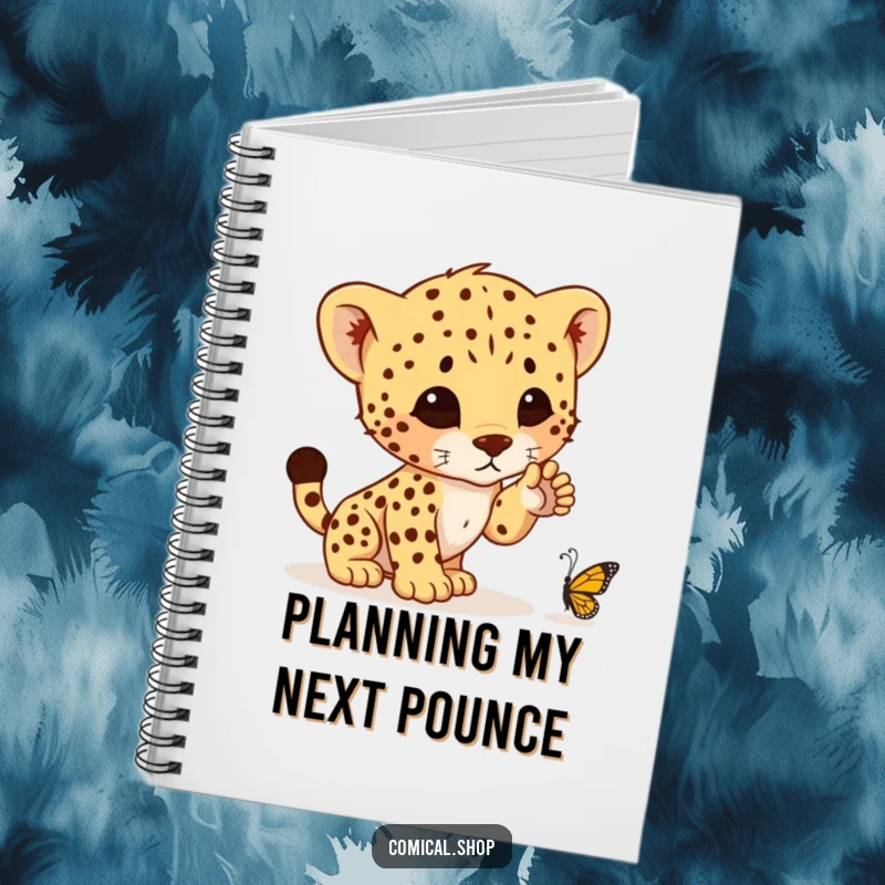 Funny notebook featuring a cheetah cub ready to pounce on a butterfly, perfect for jotting down notes with a side of humor.
