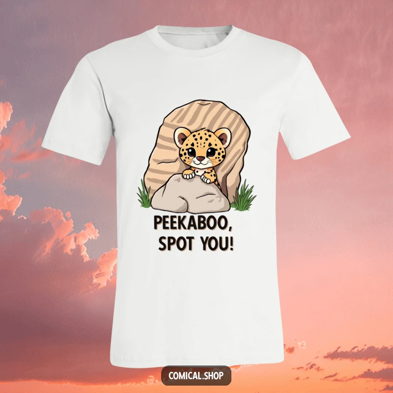 Funny cheetah cub peeking from behind a striped rock on a t-shirt, showing playful mischief for screen reader users.