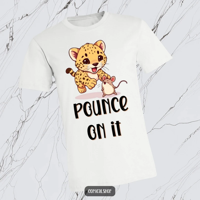 Funny cheetah cub excitedly pouncing on a bouncing toy mouse on a t-shirt, great for kids and adults.