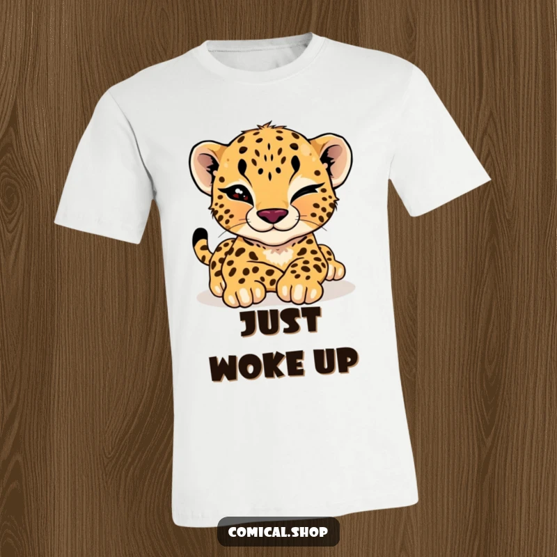 Funny cheetah cub t-shirt showcasing a languidly stretching cub giving a mischievous wink, embodying effortless cool and playful confidence.
