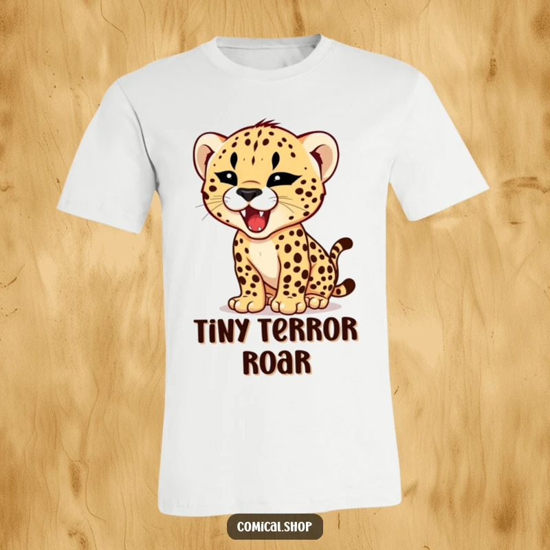 Funny t-shirt design of a cheetah cub attempting a roar with a comically tiny, fierce expression, full of hilarious potential.