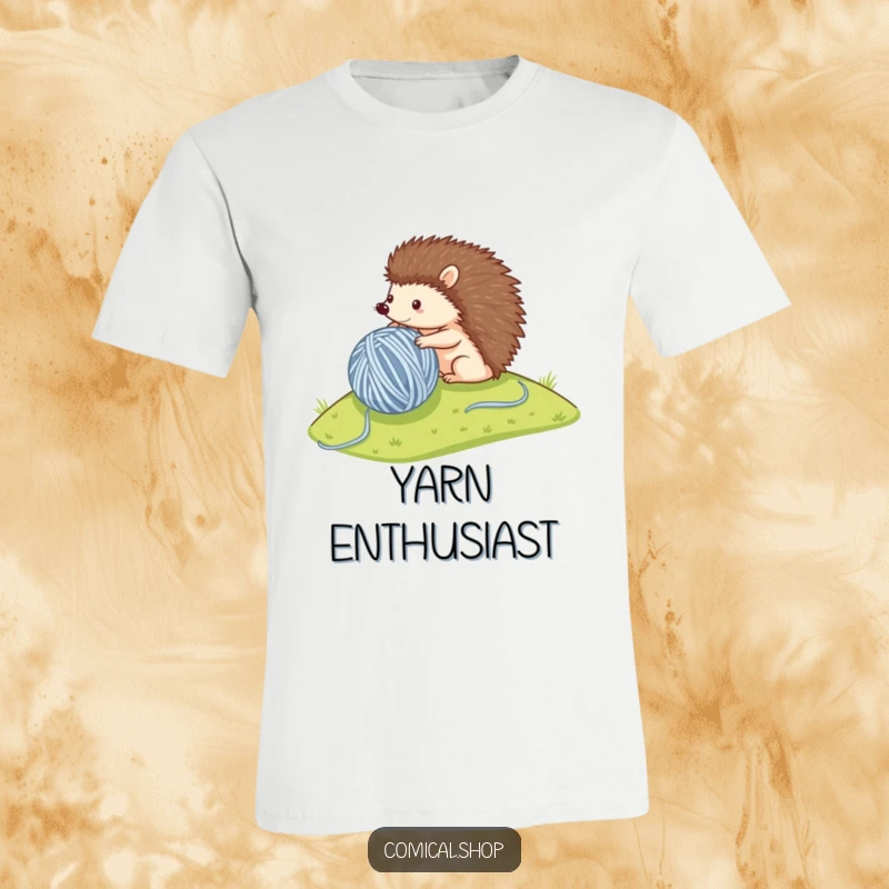 Funny t-shirt with a small hedgehog enthusiastically rolling a large ball of yarn down a hill, embodying cute determination.