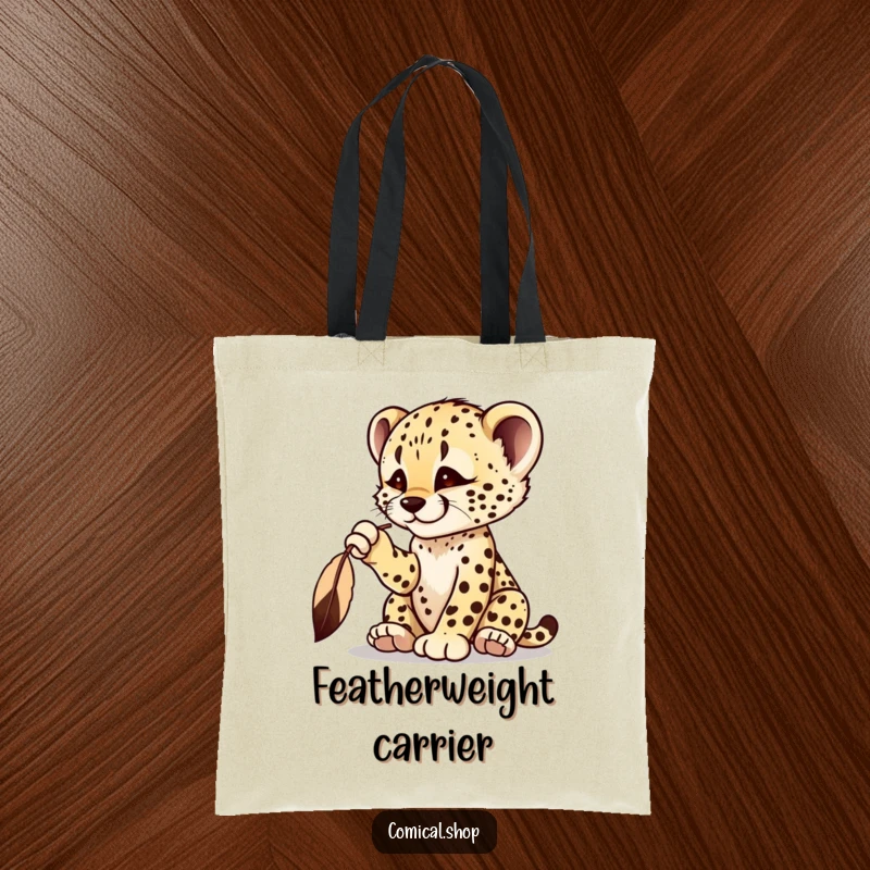 Funny cheetah cub tote bag with a playful cub batting at a dangling feather, embodying curiosity.
