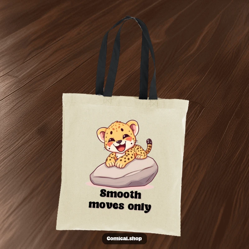 Funny tote bag showcasing a cheetah cub joyfully sliding down a smooth rock, yelping with excitement, perfect for carrying daily items.